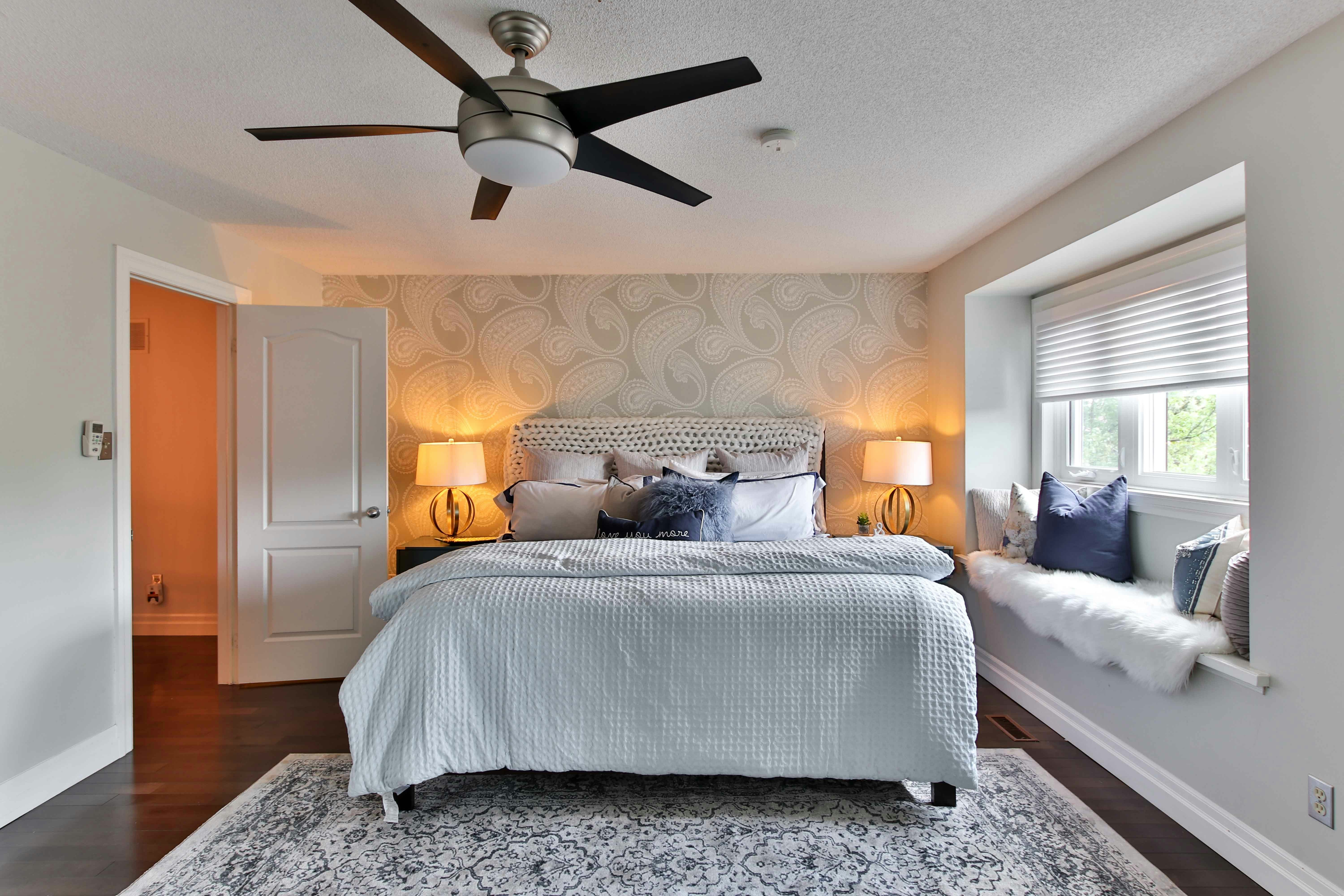 Bedroom in a DC home with a new ceiling fan installed.