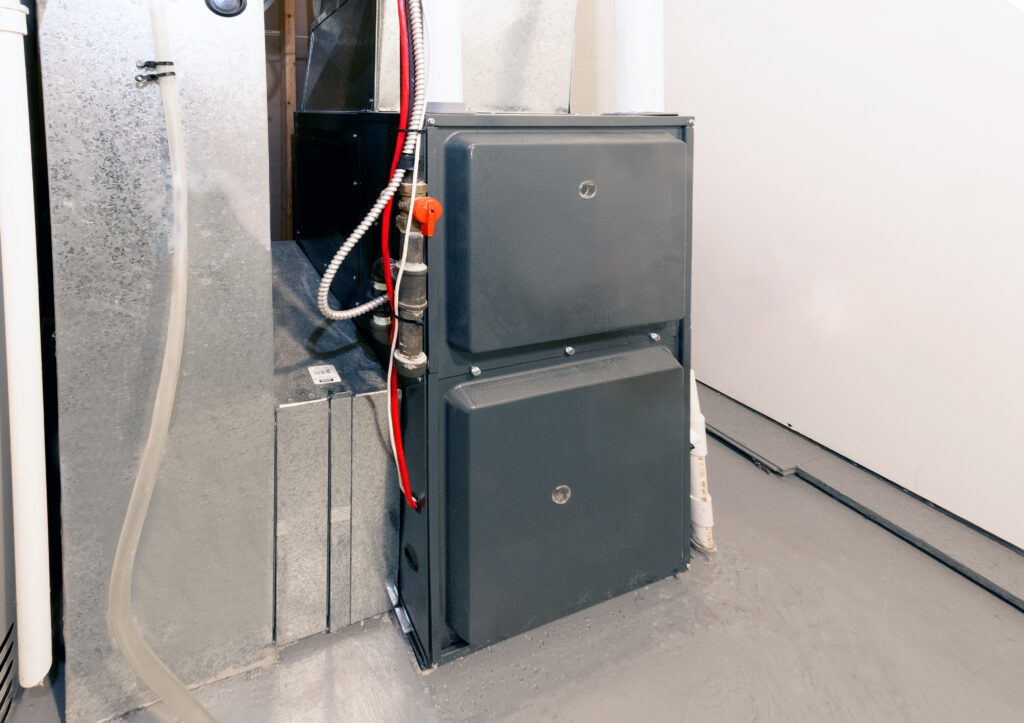 A home's energy-efficient furnace installed in a basement.