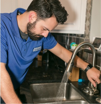 F.H Furr technician performing air conditioning repair