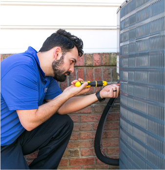 F.H Furr technician performing air conditioning repair