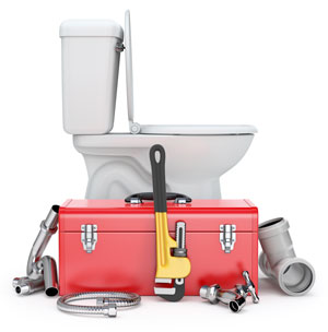 White toilet with red toolbox in front of it, on white background.
